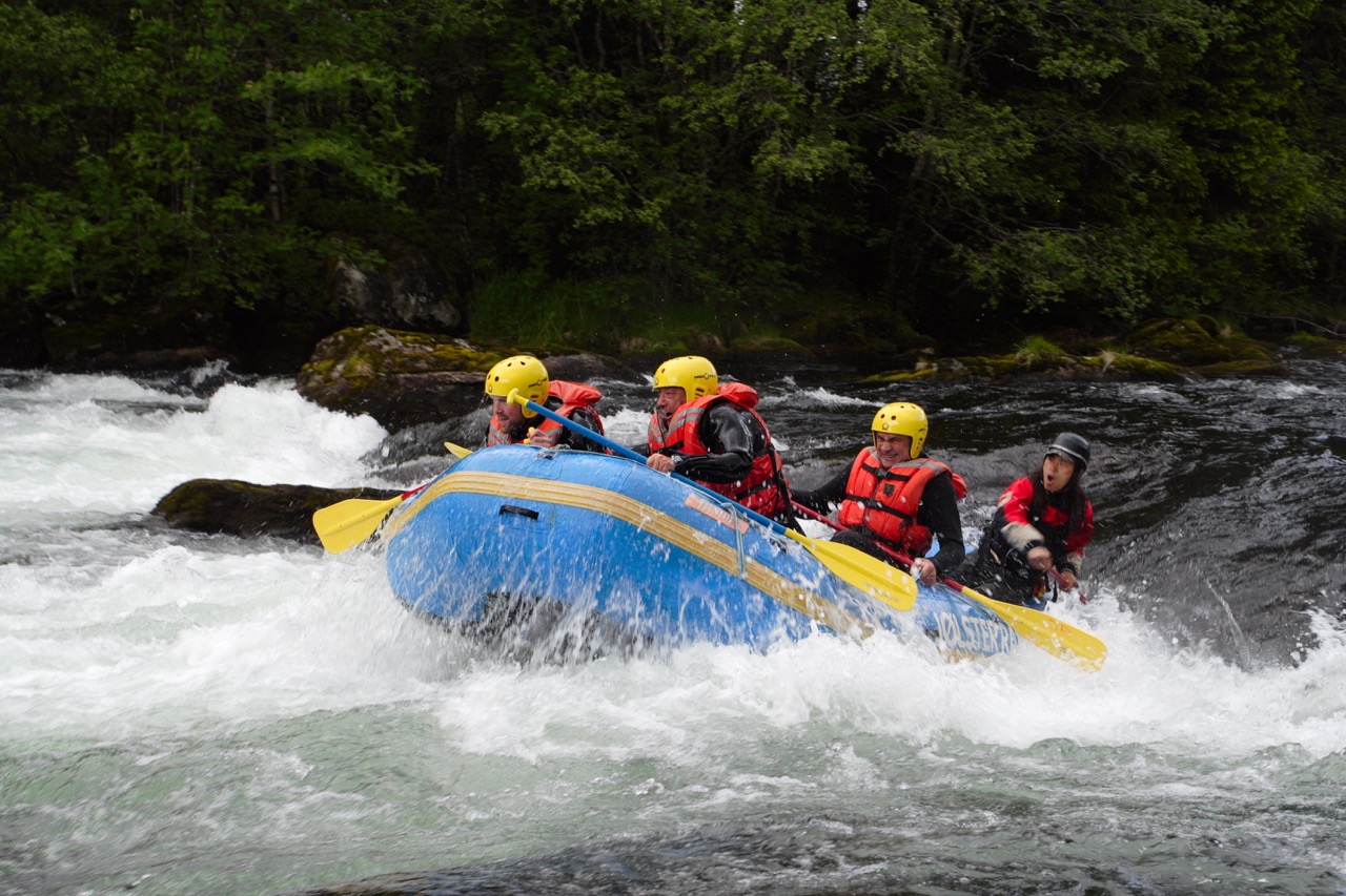 group of men rafting over the river at Norway