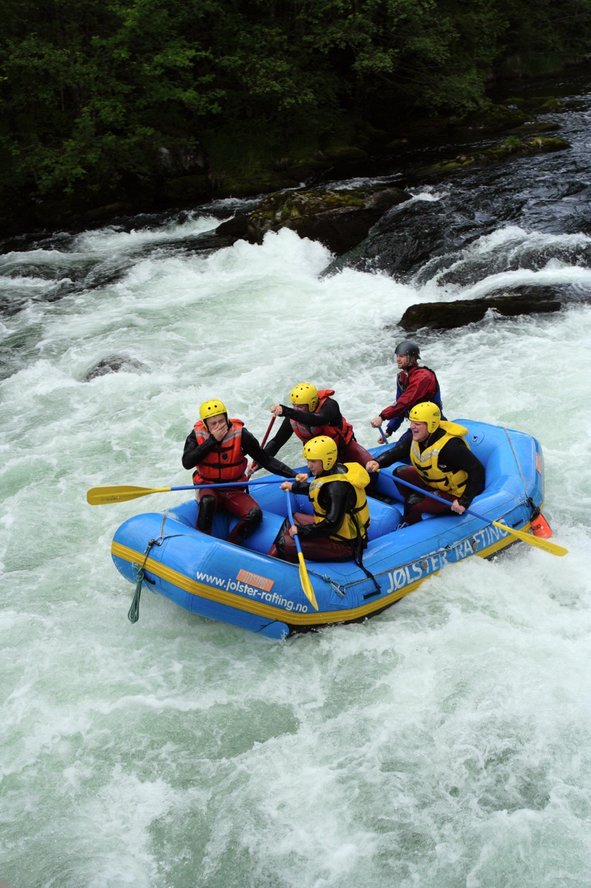group of men rafting over the river at Norway